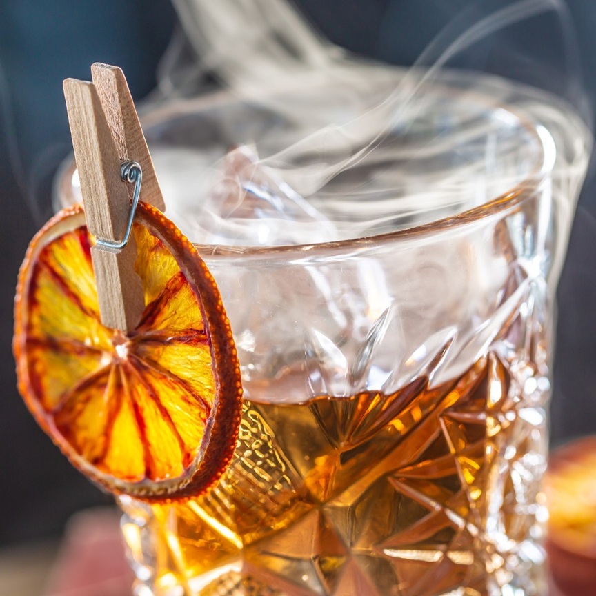 From Flame to Glass: The Art of Smoked Cocktails at Camp Bar & Feed